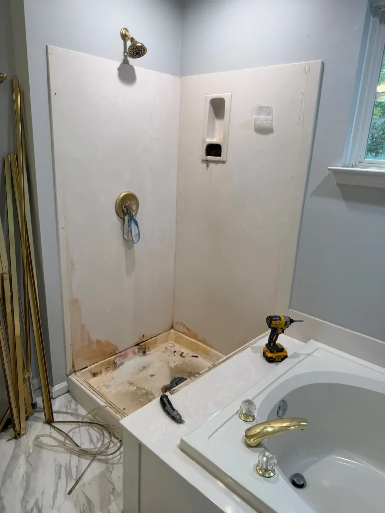 Existing shower pre-demo by Seacoast Tile Pros