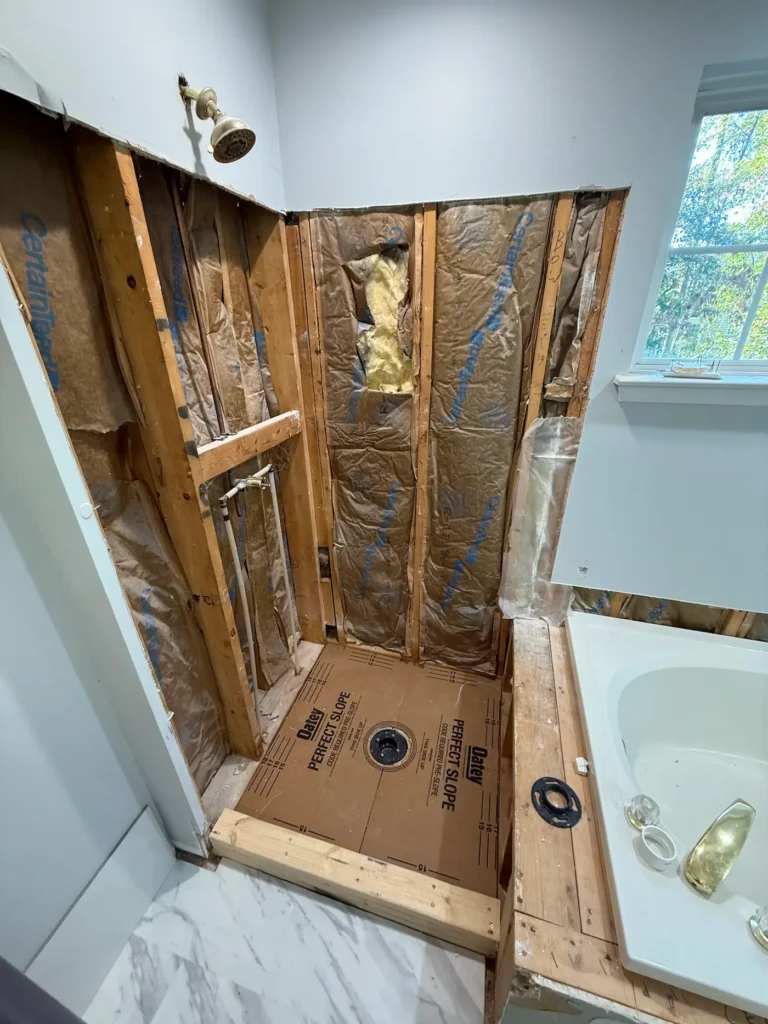 Post demo primary shower by Seacoast Tile Pros
