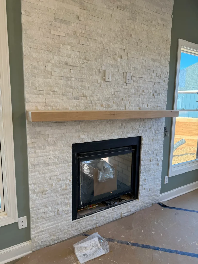 Stacked stone fireplace installation by Seacoast Tile Pros